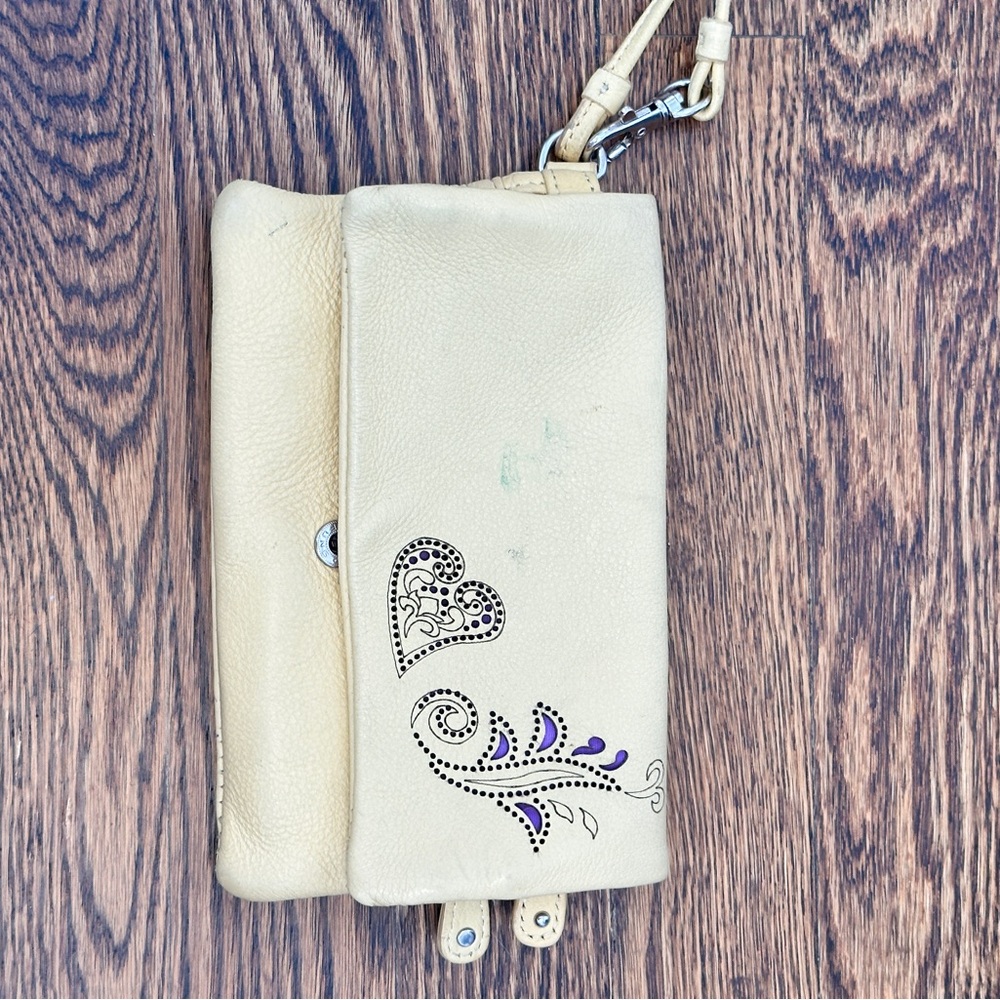 Elegant Cream Leather Clutch with Embellished Design